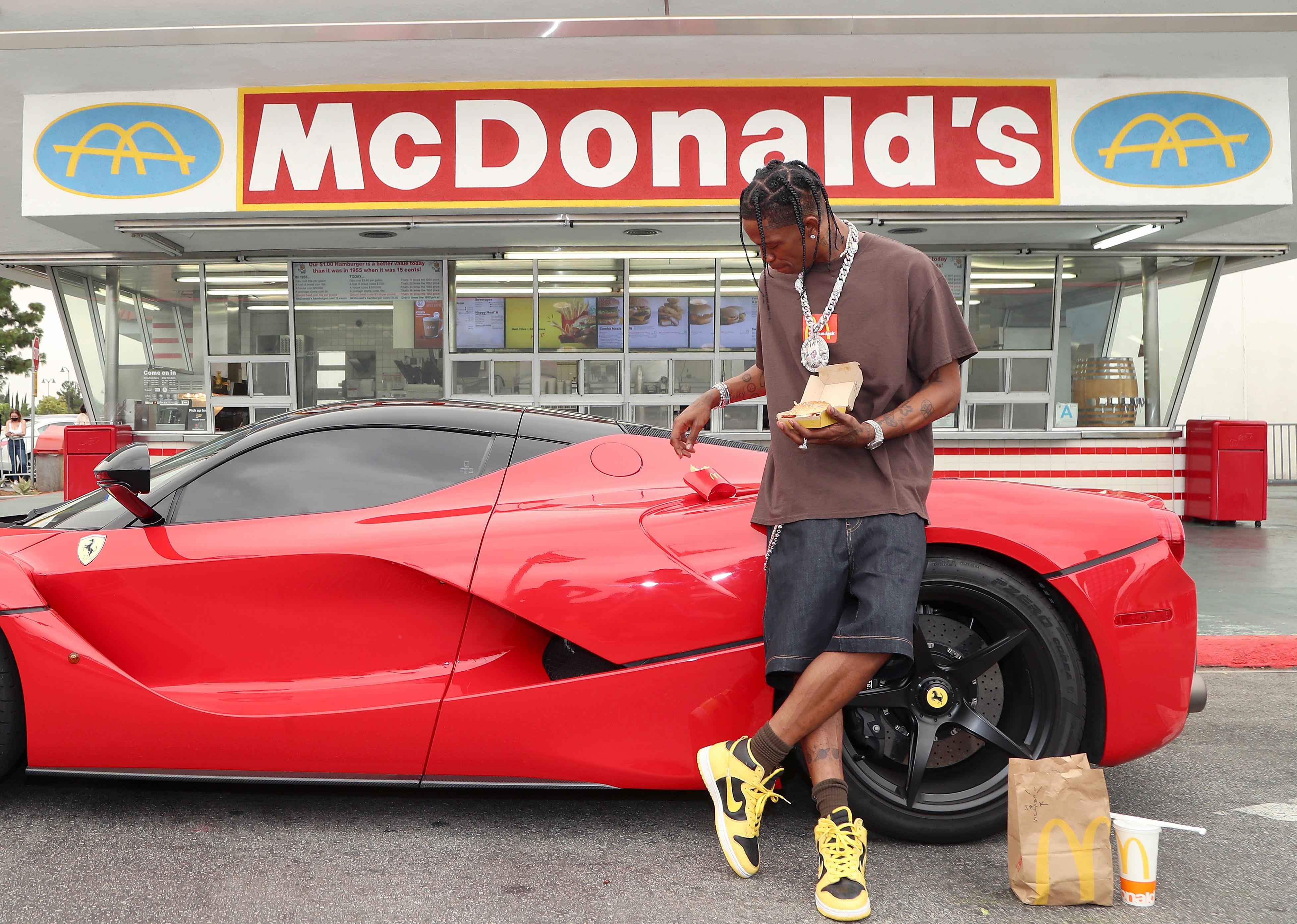 Travis Scott in front of a McDonald's