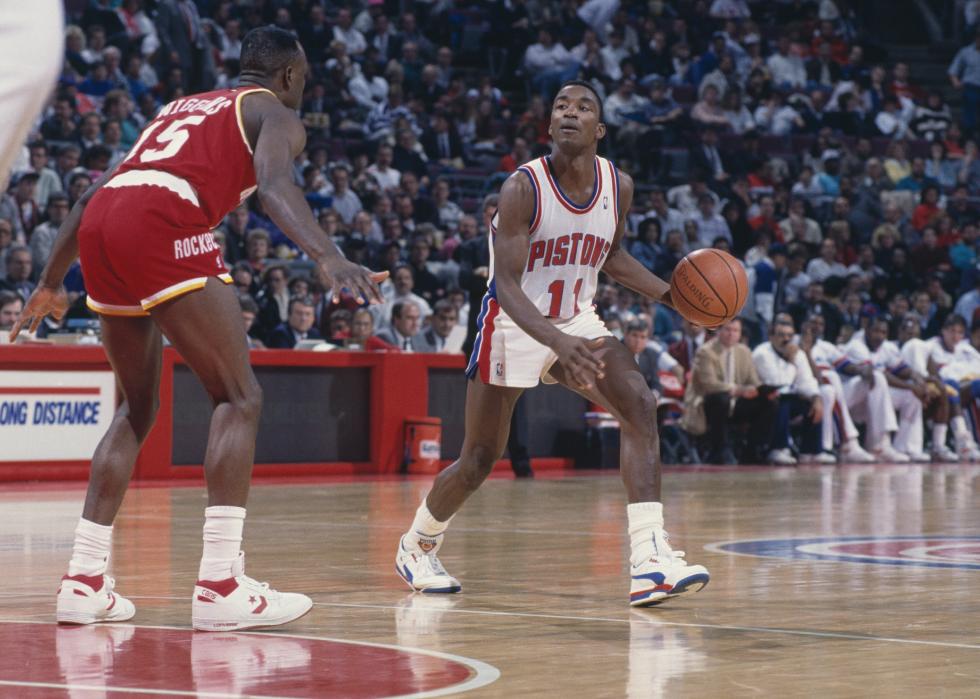 Isiah Thomas with the Detroit Pistons dribbles a basketball
