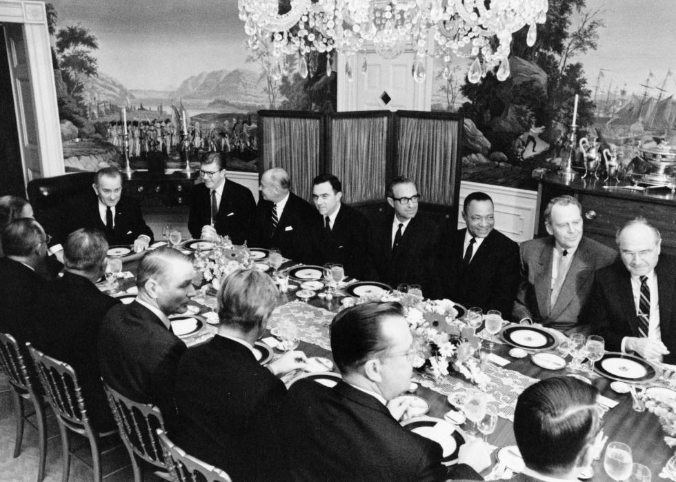President Lyndon Johnson hosts a dinner meeting in the White House