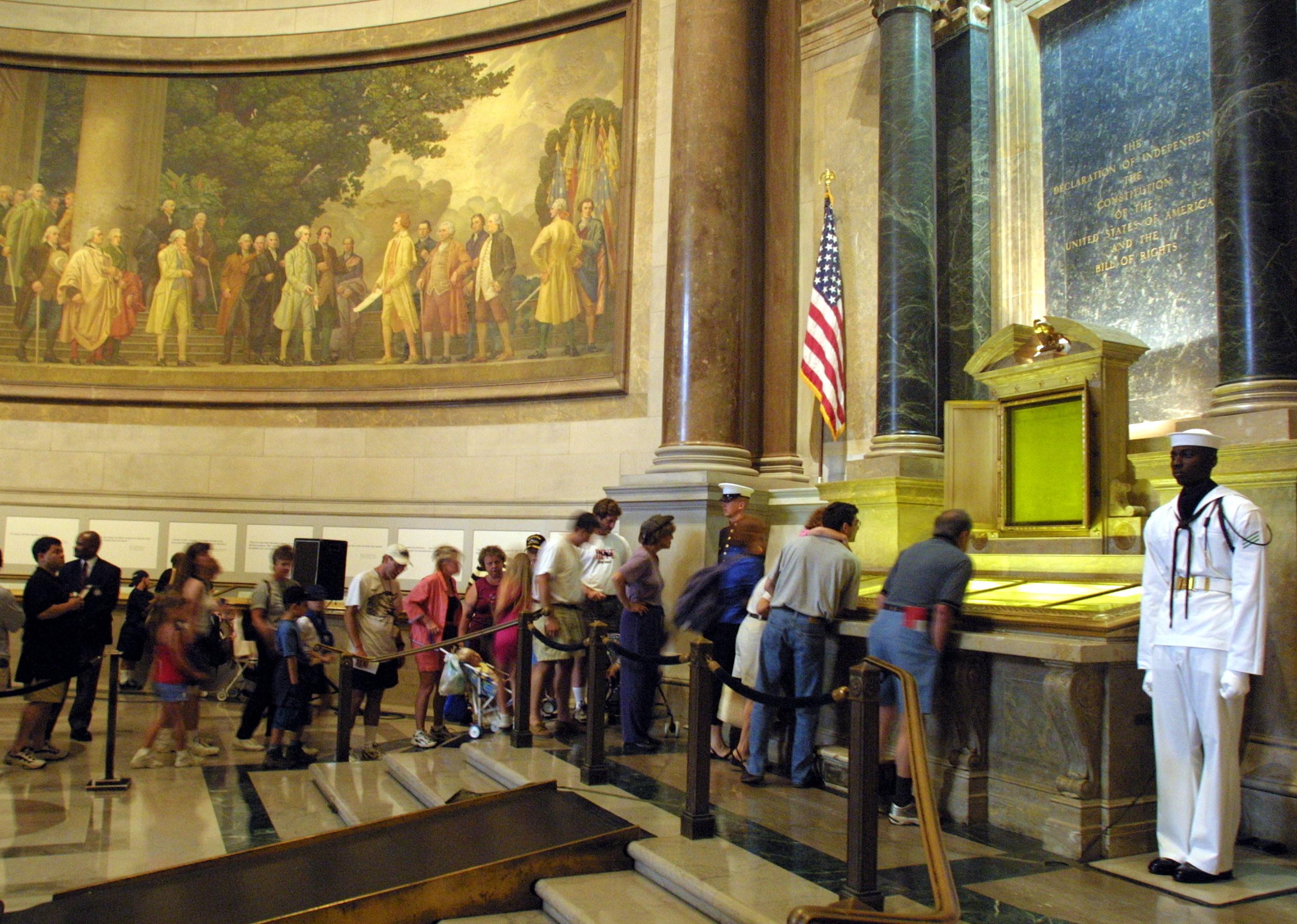 Visitors wait to view the Declaration of Independence, the Constitution and the Bill of Rights