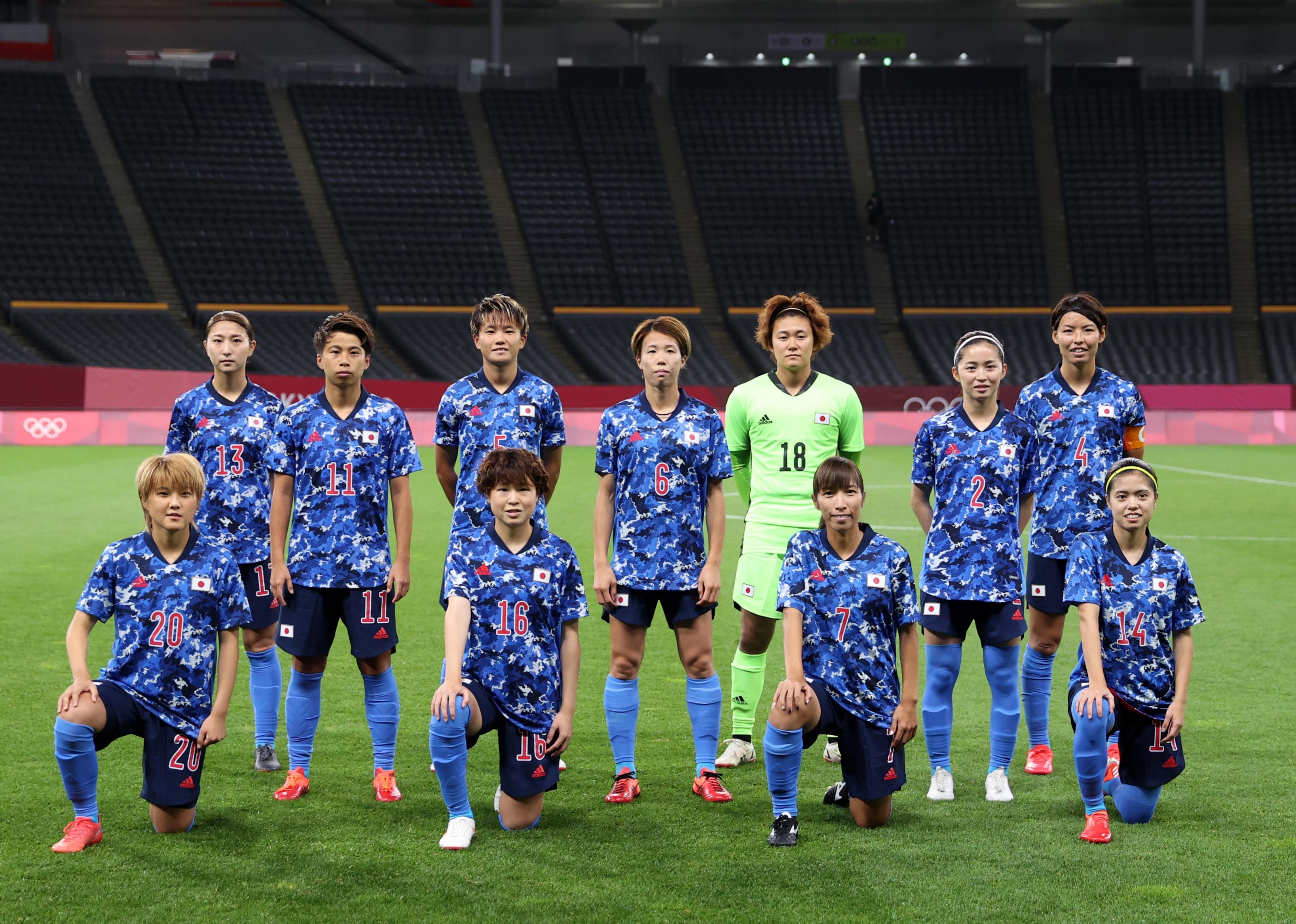 Players of Team Japan pose for a team photo prior to the Women's First Round Group E match between Japan and Great Britain during the Tokyo 2020 Olympic Games.