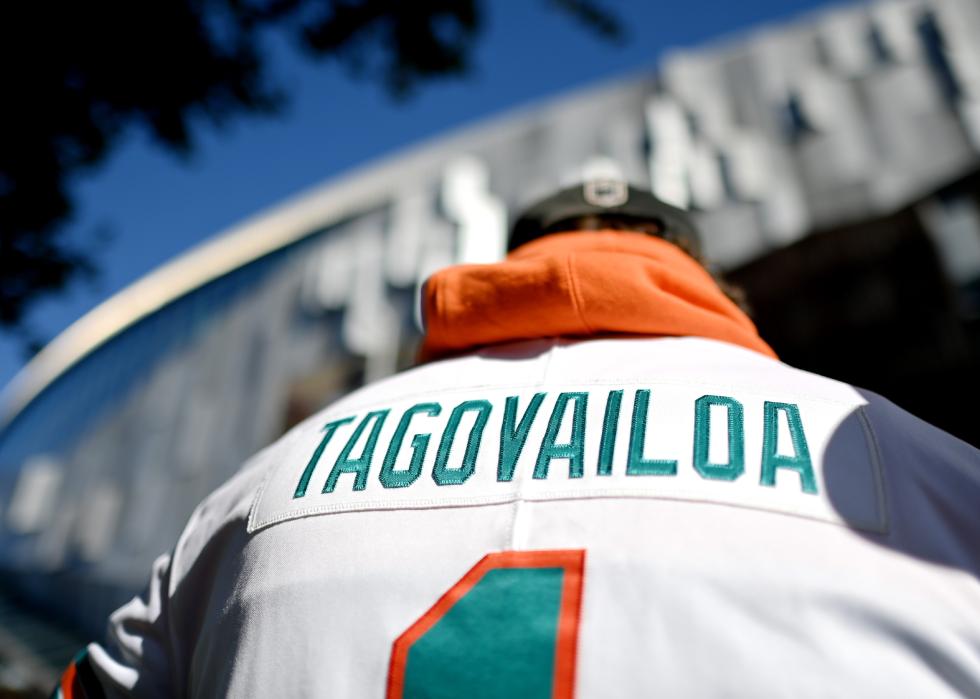 A fan is seen wearing a Tagovailoa jersey of Miami Dolphins outside the Tottenham Hotspur Stadium.