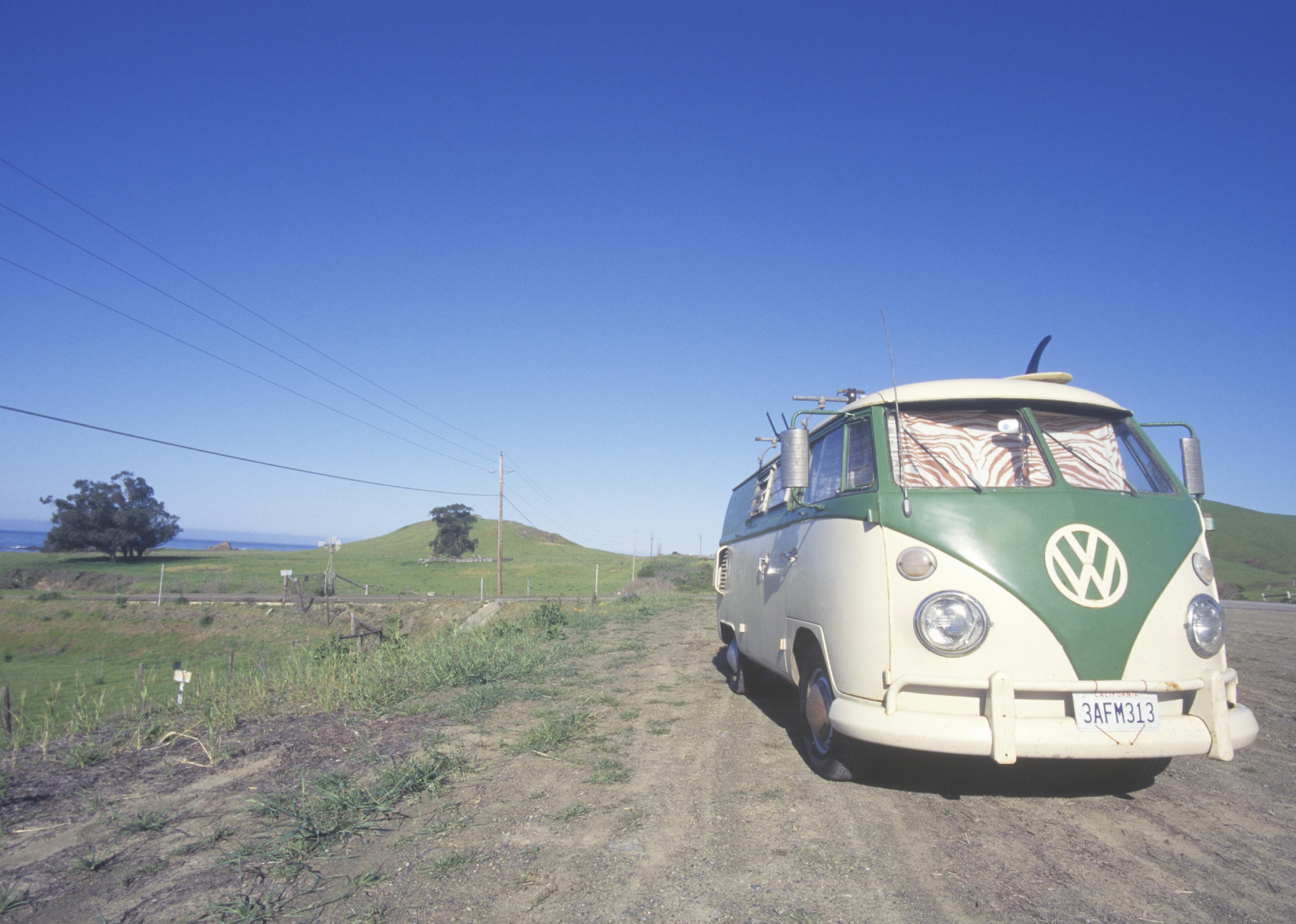 A Volkswagen van parked on the roadside.