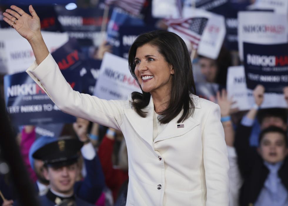 Nikki Haley waves to supporters while arriving for her first campaign event.