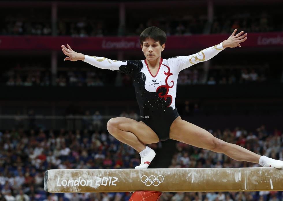 Oksana Chusovitina on the beam during the Olympics