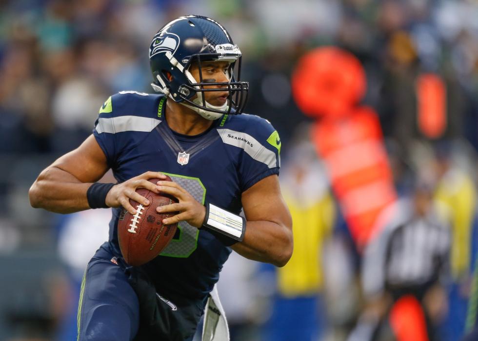 Russell Wilson #3 of the Seattle Seahawks rolls out to pass.