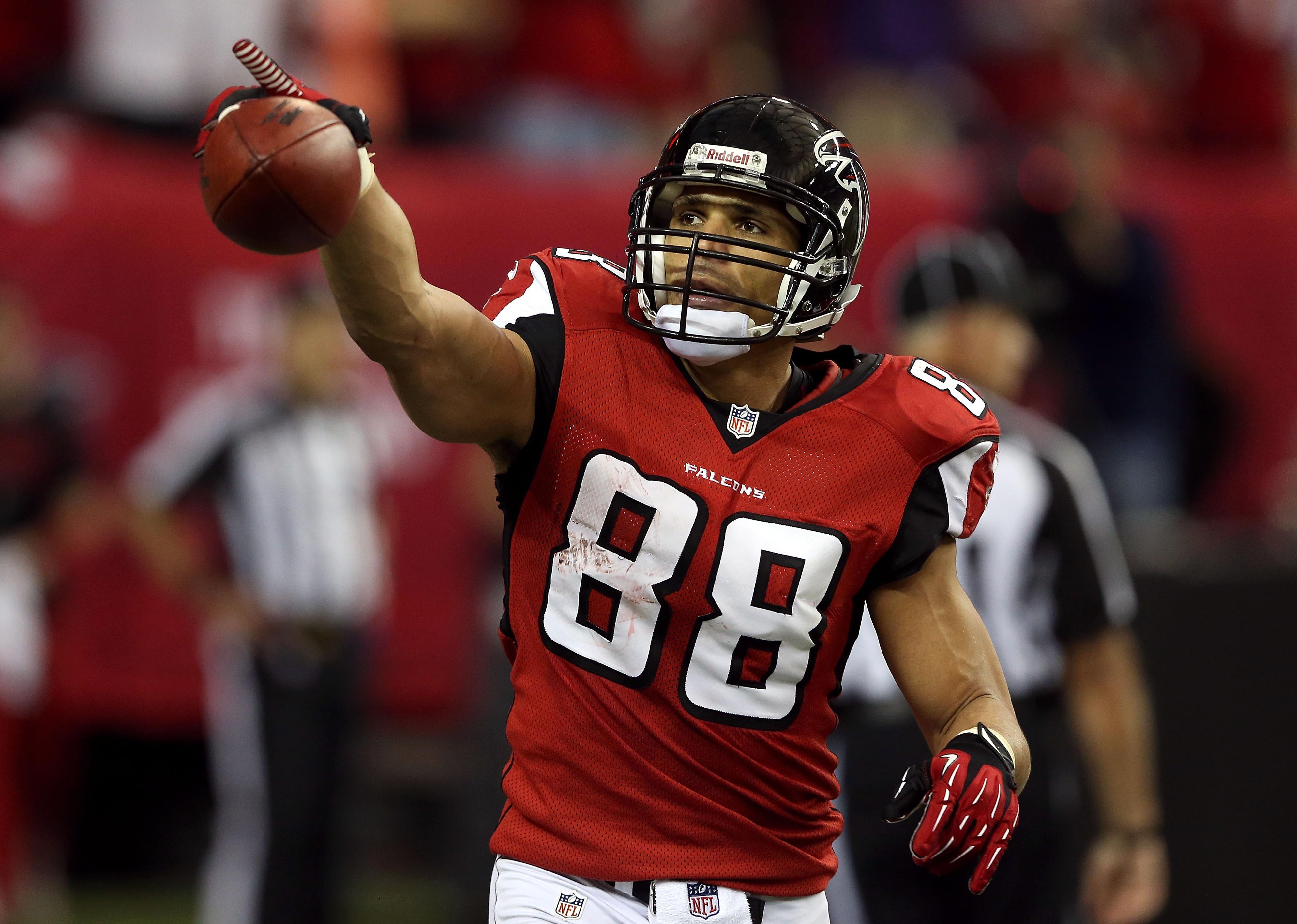Tony Gonzalez of the Atlanta Falcons celebrates after catching a touchdown