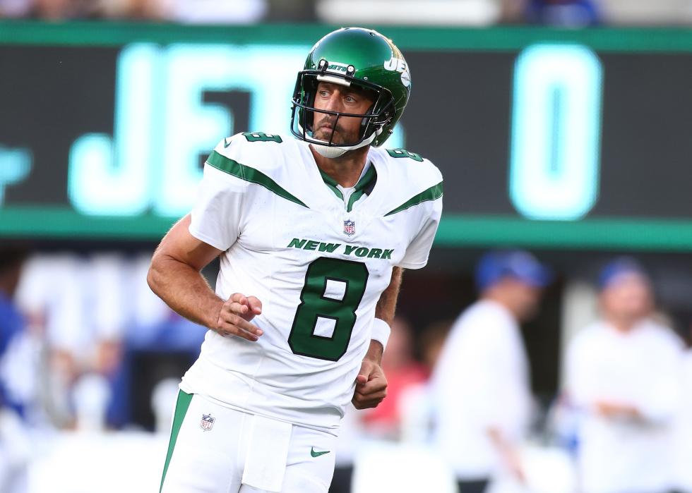 Aaron Rodgers of the New York Jets reacts after throwing a touchdown pass.