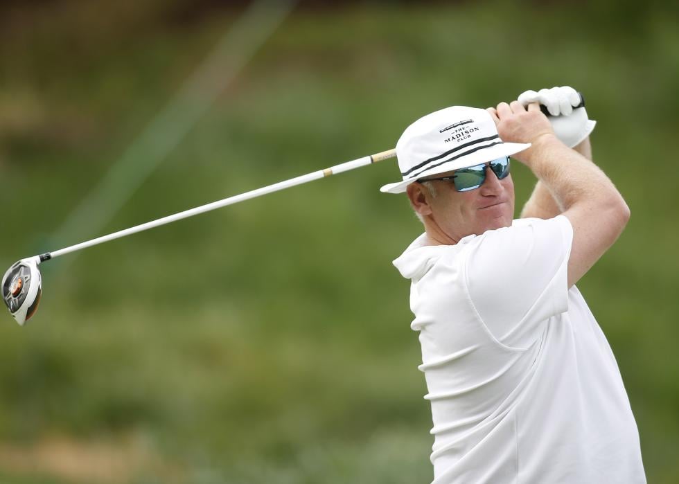 Brett Hull hits a tee shot during an Invitational golf tournament