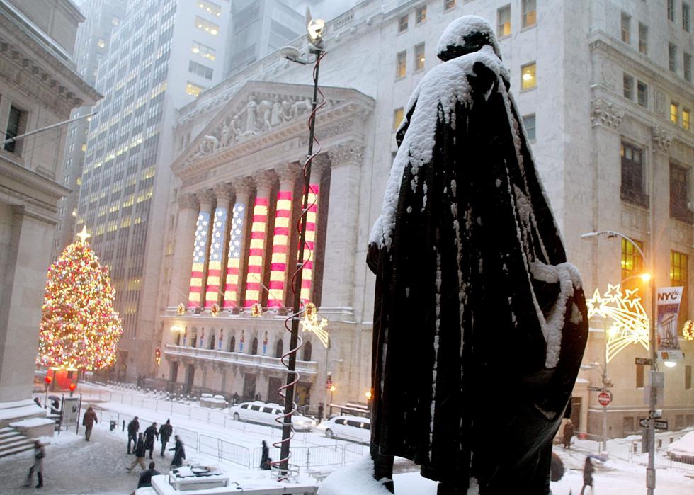 The New York Stock Exchange lit up with Christmas decorations and fresh snow.