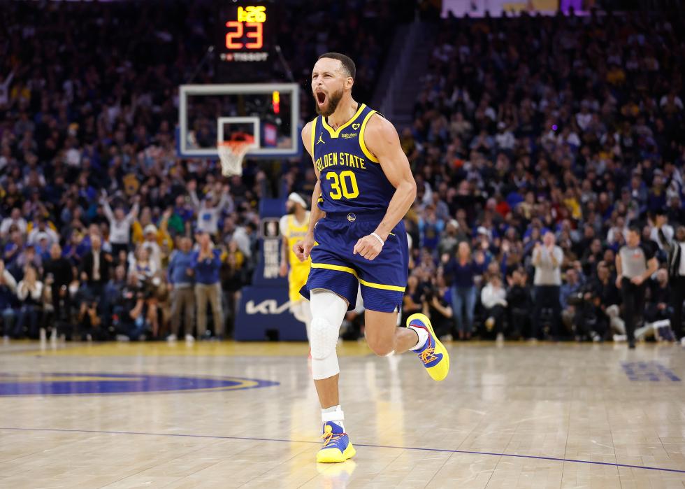 Stephen Curry #30 of the Golden State Warriors reacts after making a three-point shot.