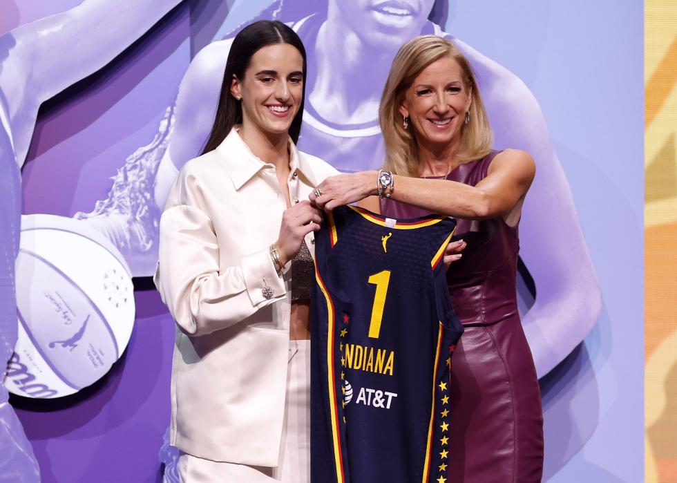 Caitlin Clark poses with Commissioner Cathy Engelbert after being selected first overall pick.