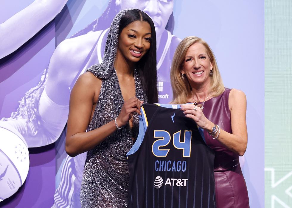 Angel Reese poses with WNBA Commissioner Cathy Engelbert after being selected seventh overall pick.