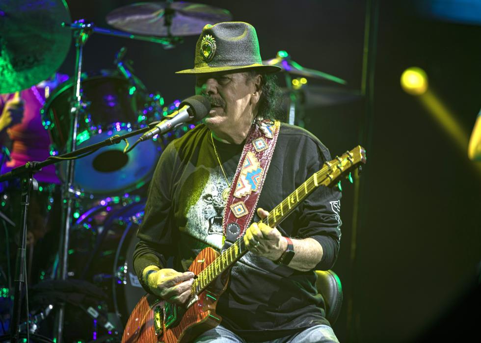 Carlos Santana performs on stage during the Oneness Tour 2024.