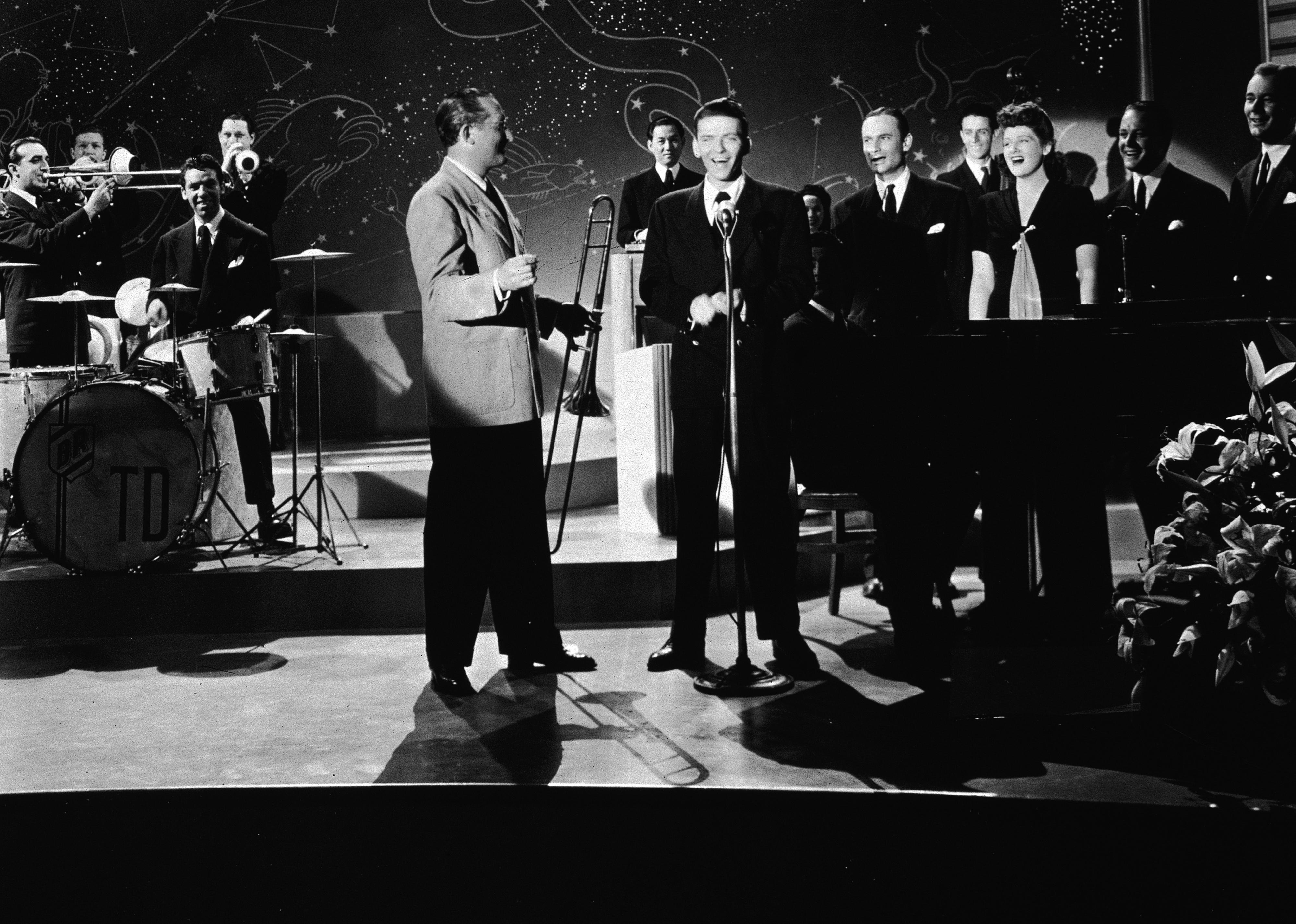 Frank Sinatra performs with the Tommy Dorsey Orchestra in a still from the film, 'Ship Ahoy'.