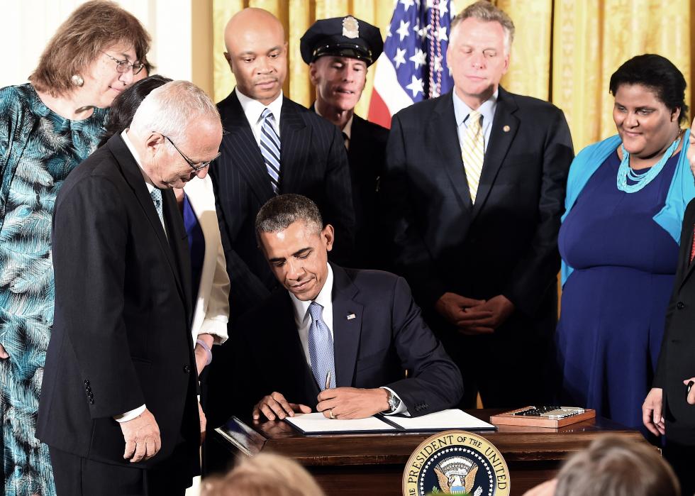 President Barack Obama signs an Executive Order to protect LGBTQ+ rights