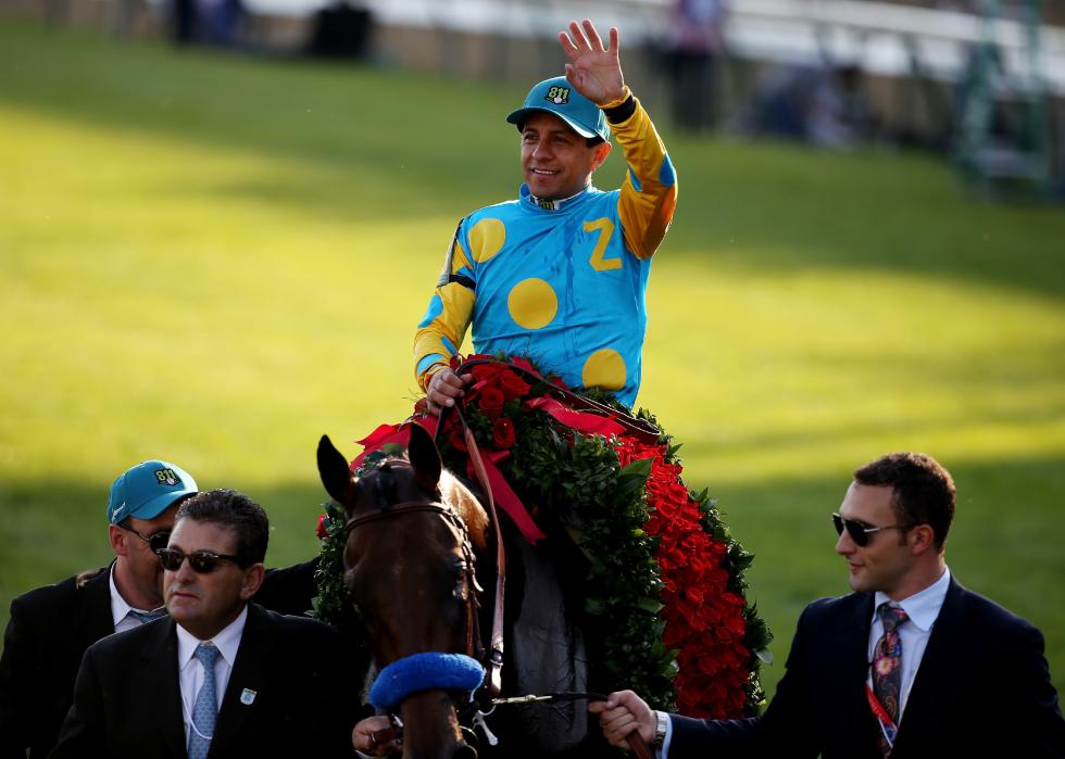 Victor Espinoza celebrates after winning the Kentucky Derby