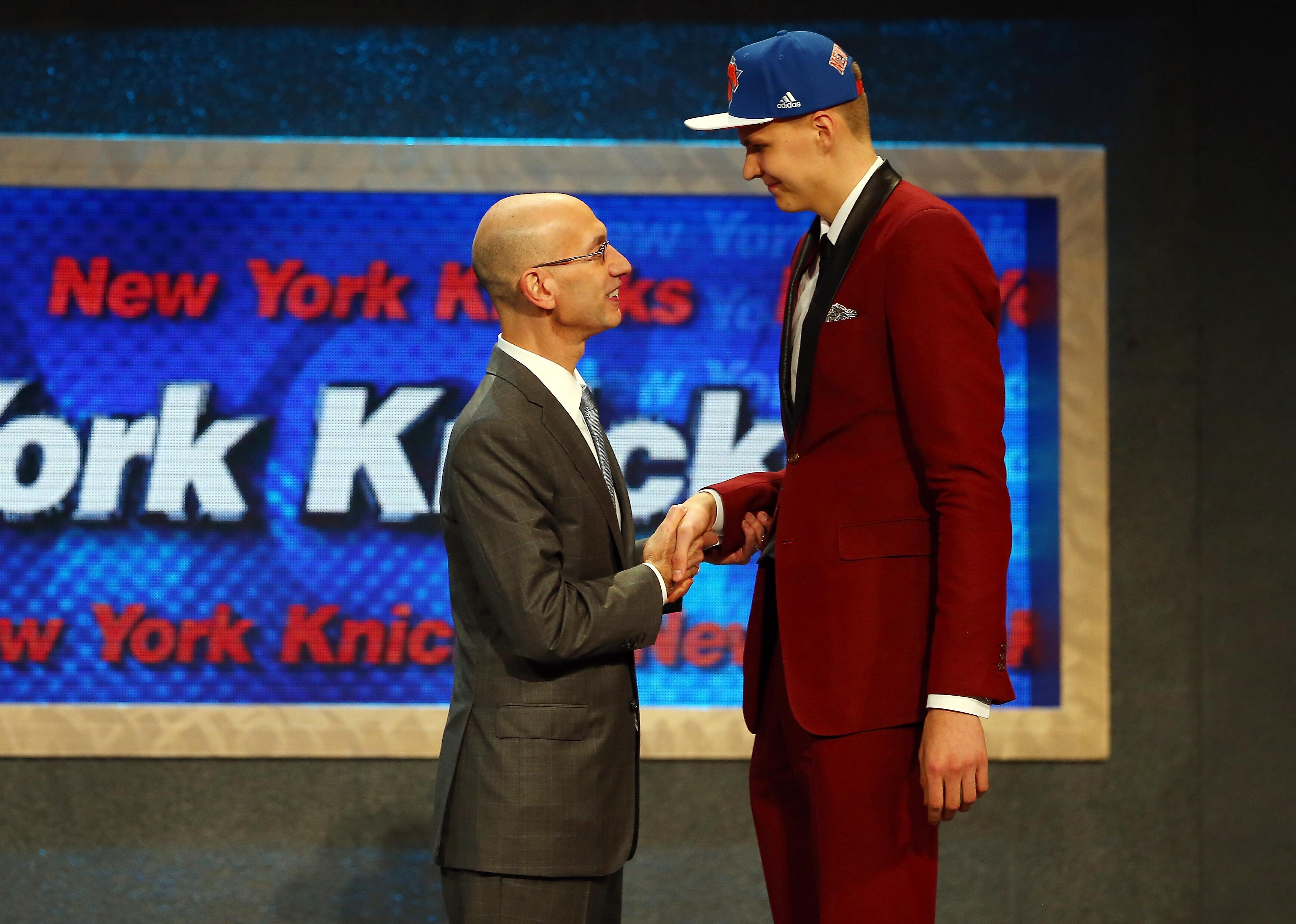 Kristaps Porzingis meets with Commissioner Adam Silver after being drafted.