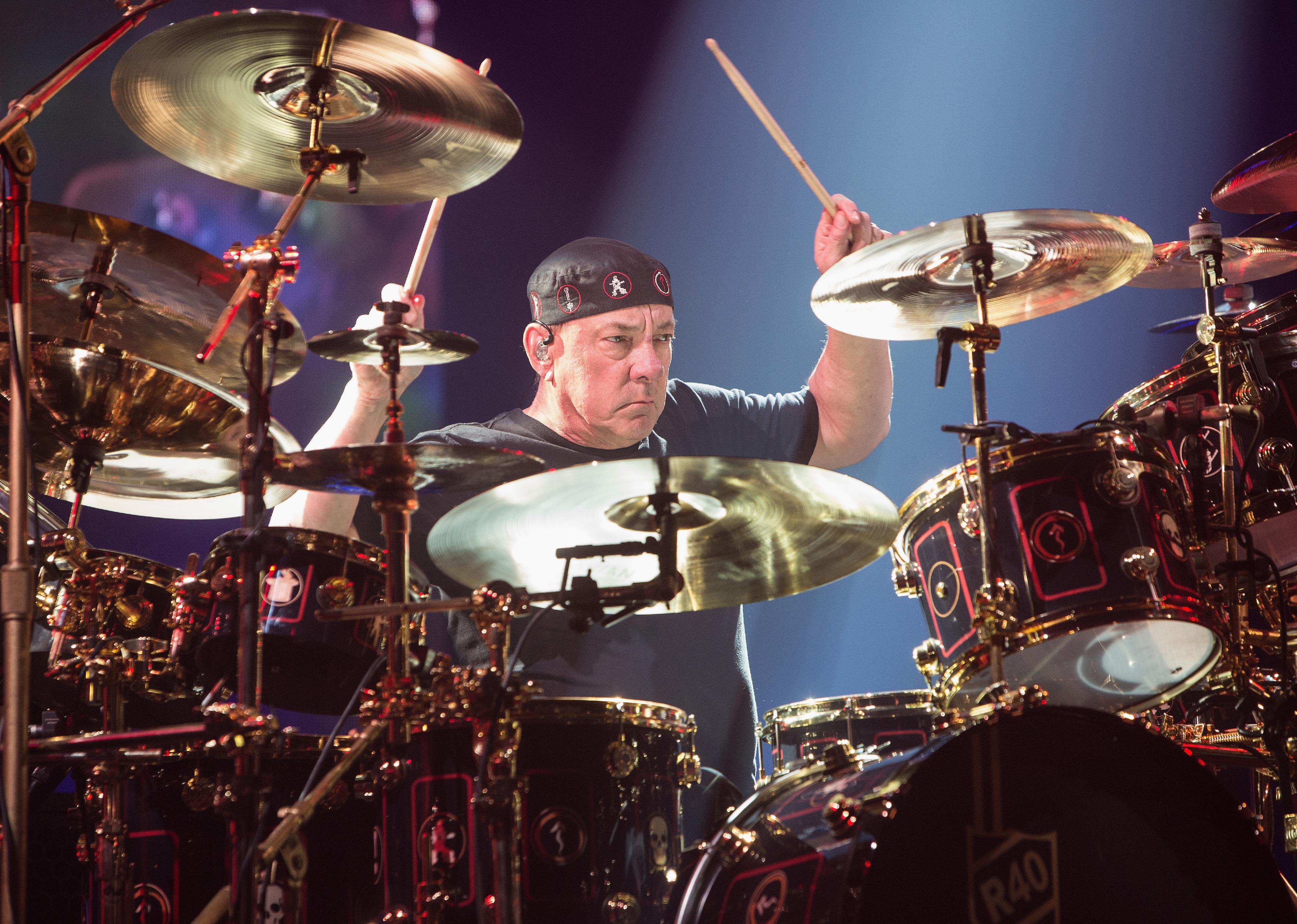 Neil Peart of Rush performing on stage.