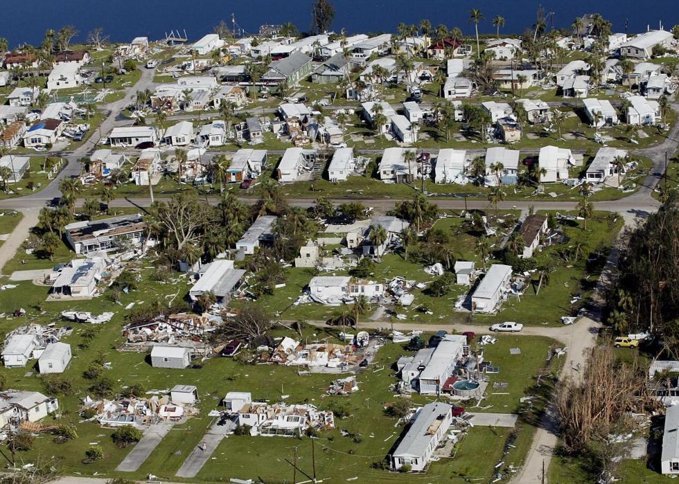 An aerial view of a trailer park covered in wreckage.