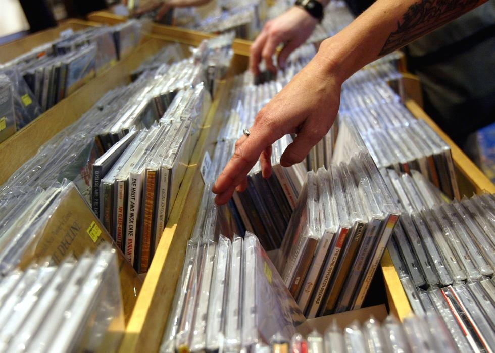 People look at compact disks in a music store