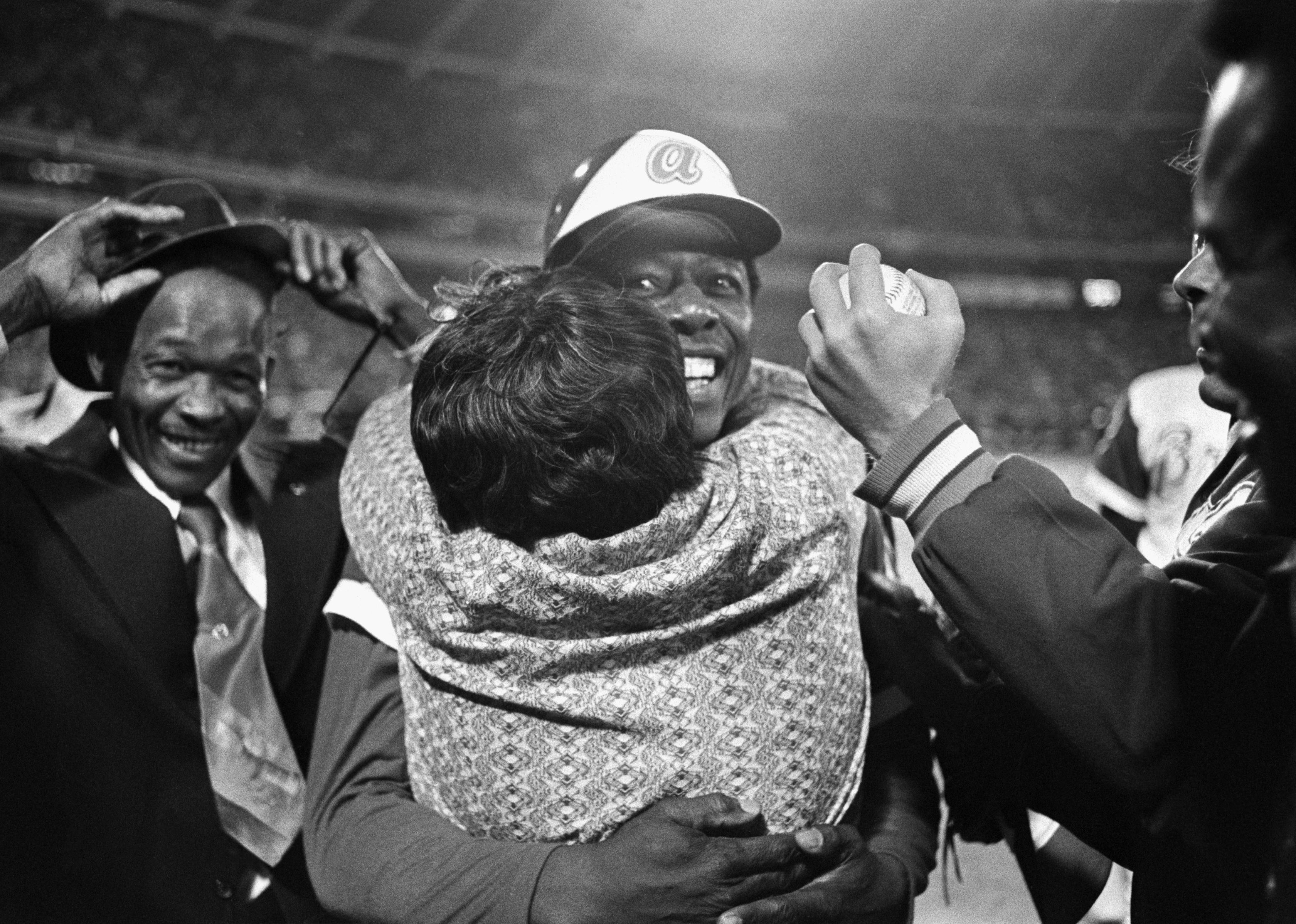 Hank Aaron's hugs his mother after hitting home run number 715. 