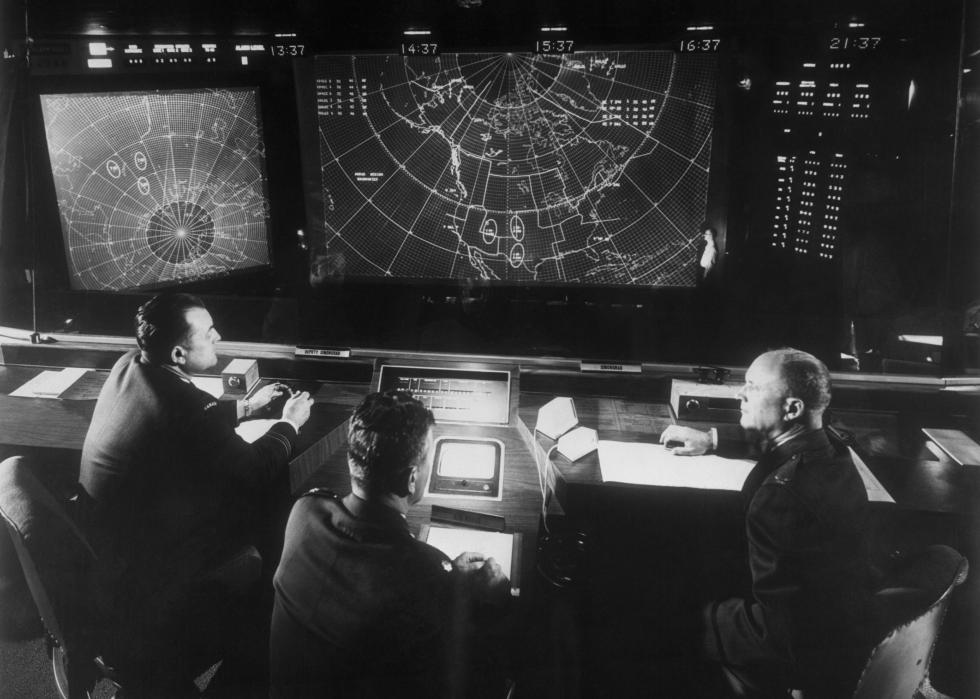 Men sit below radar at NORAD headquarters.