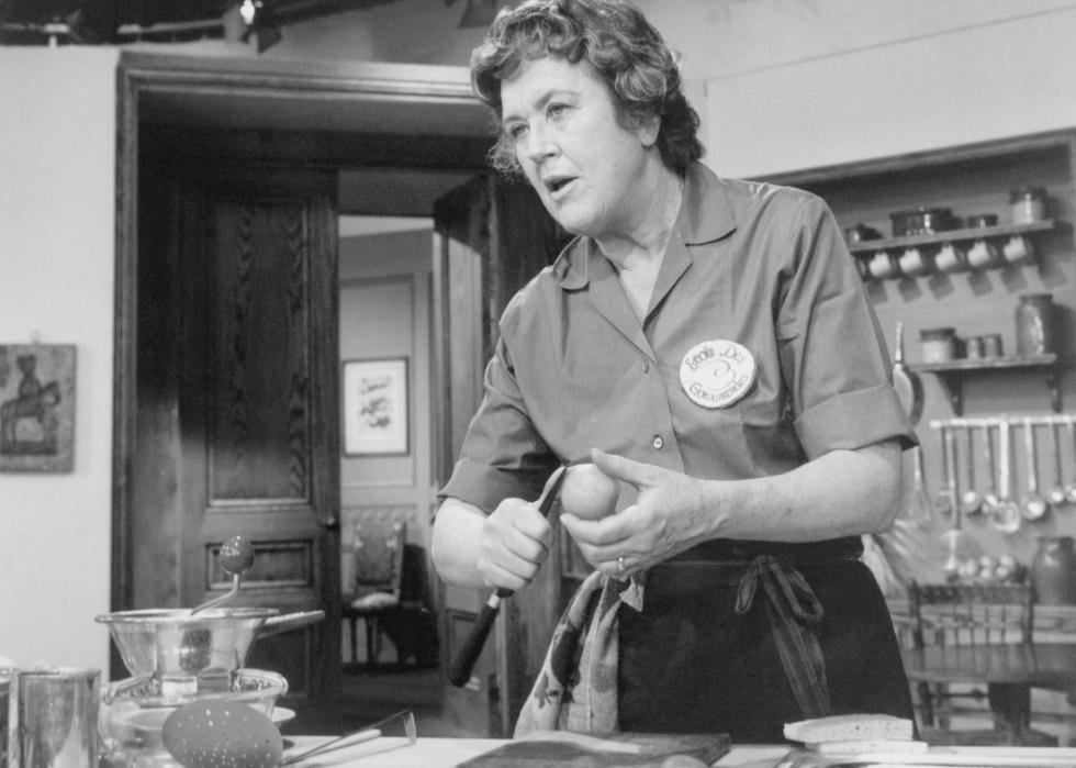 Julia Child prepares a dish for a TV audience