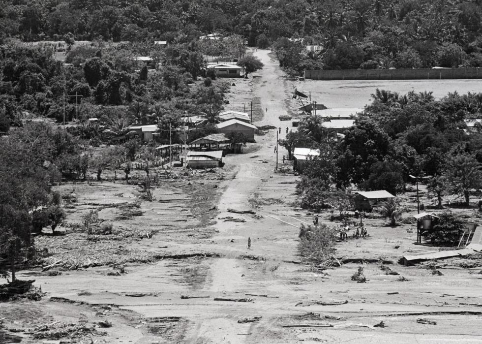 An aerial view of a residential area near a beach destructed by a storm.