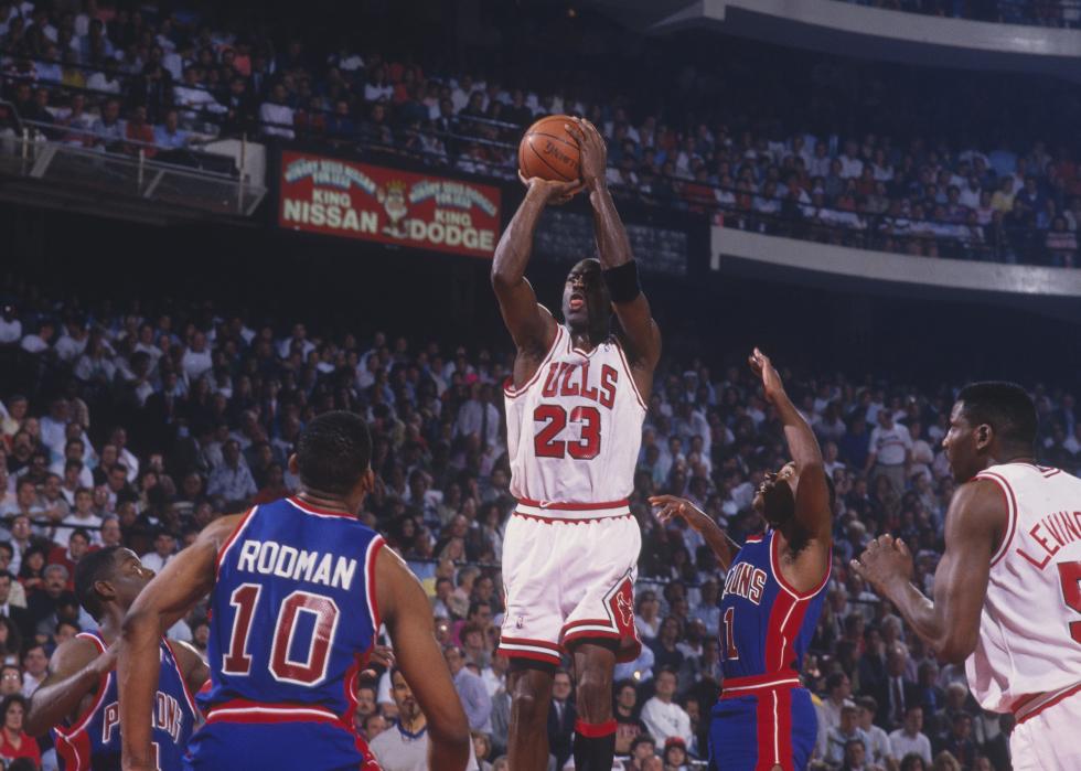 Michael Jordan of the Chicago Bulls jumps to shoot a basket 