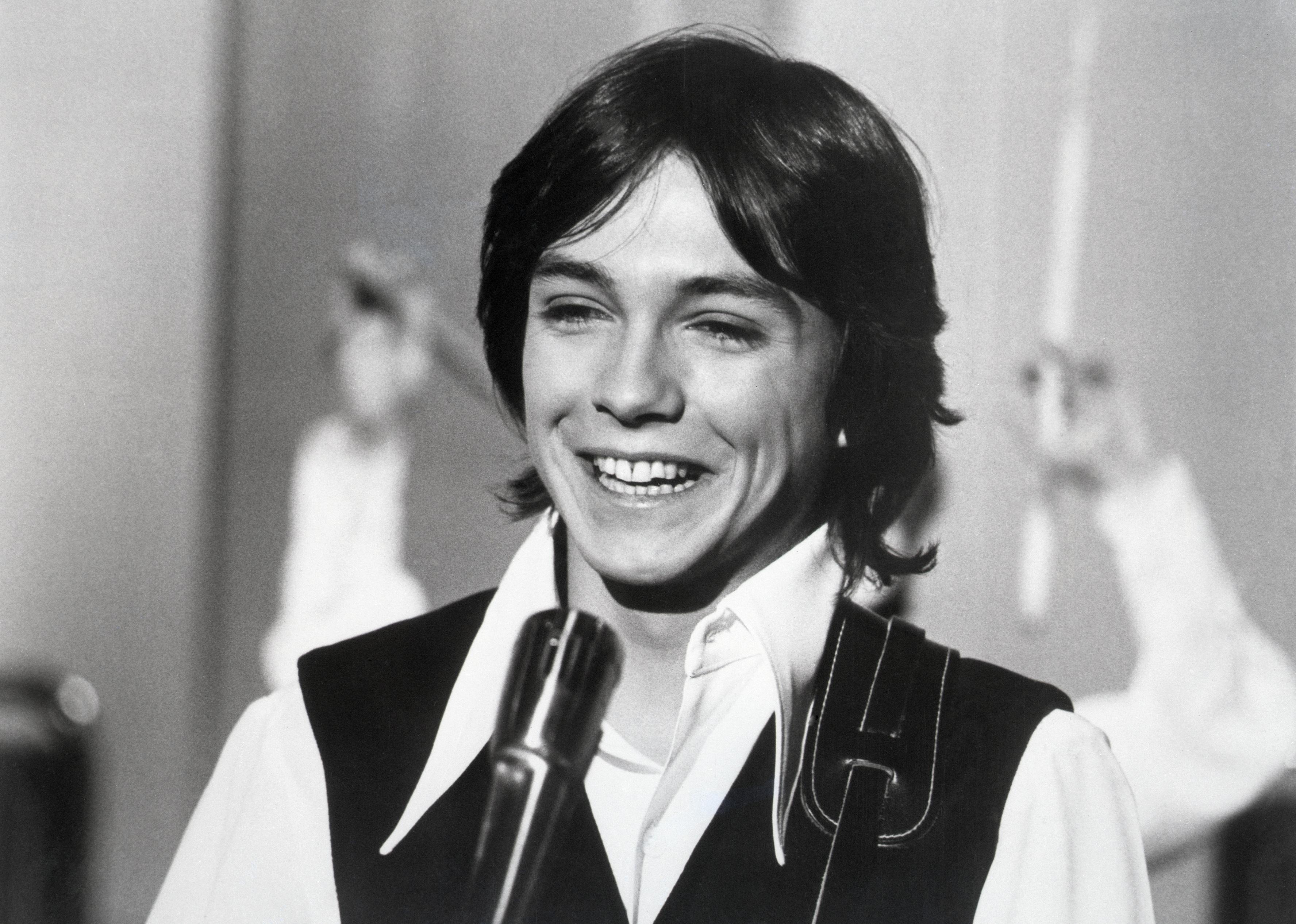 David Cassidy is seen in closeup, candidly smiling.