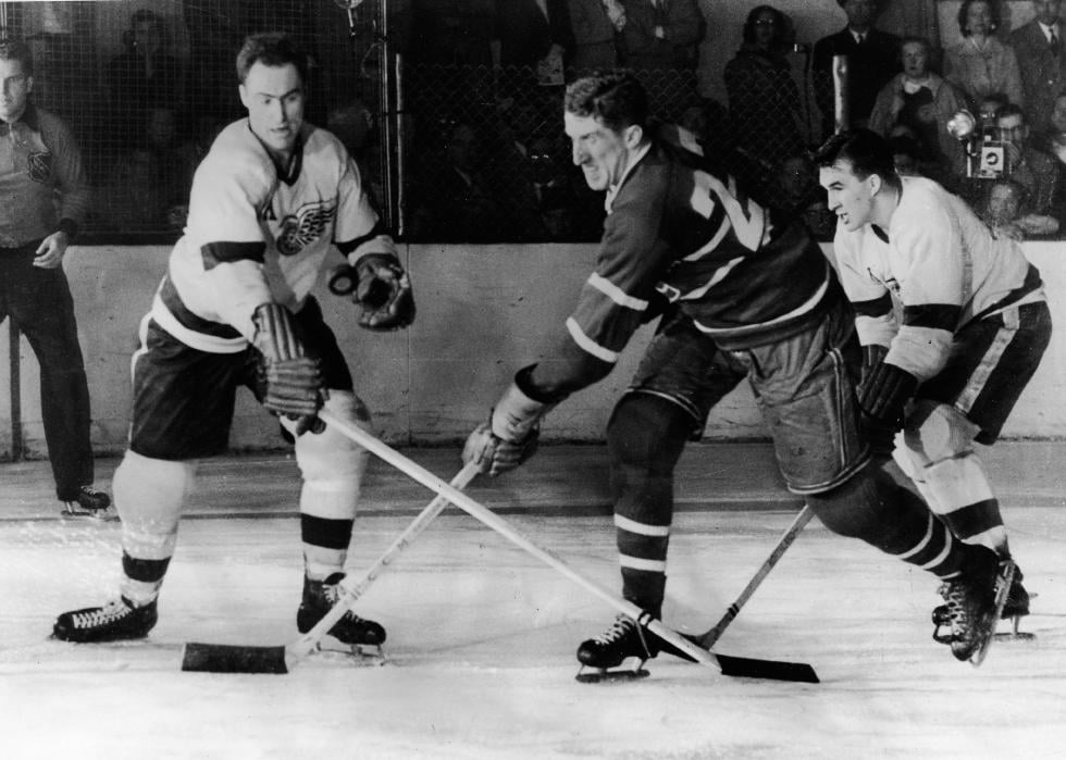 Red Kelly battles for an airborne puck during the final game of the Stanley Cup