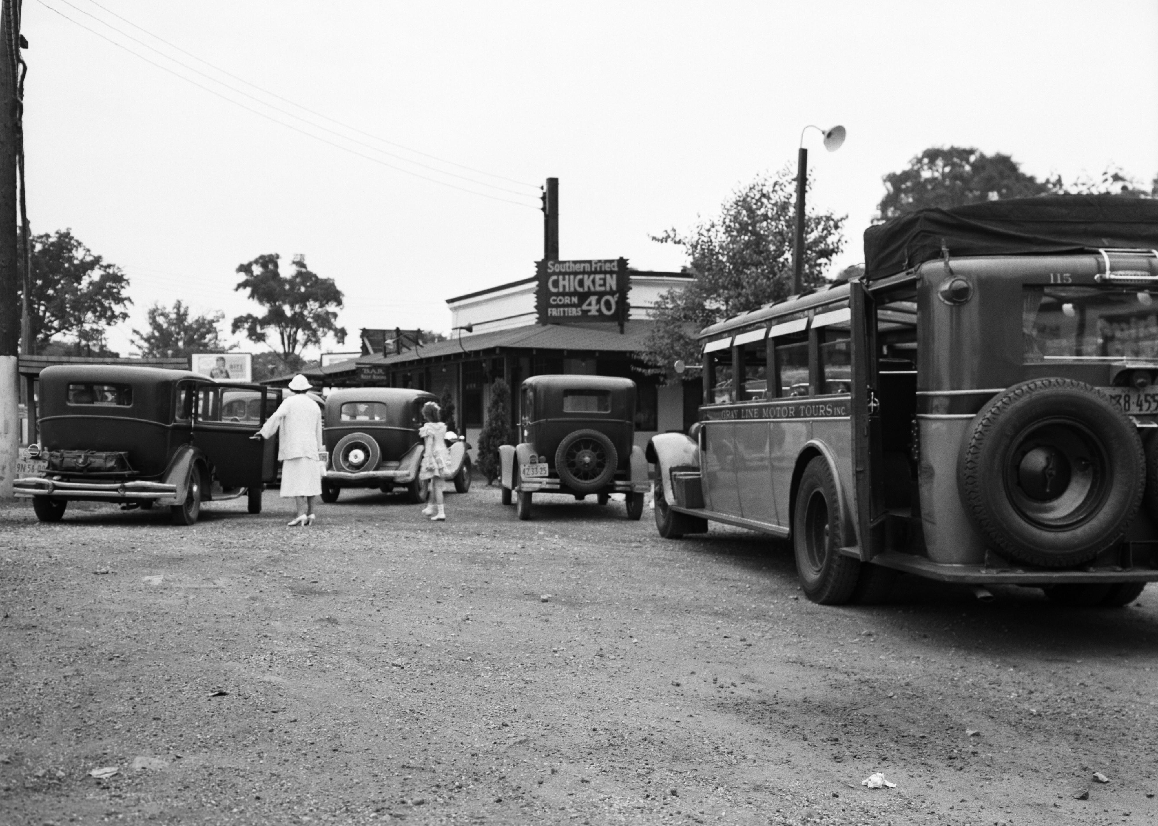 Roadside fried chicken joint and sign in 1930s.