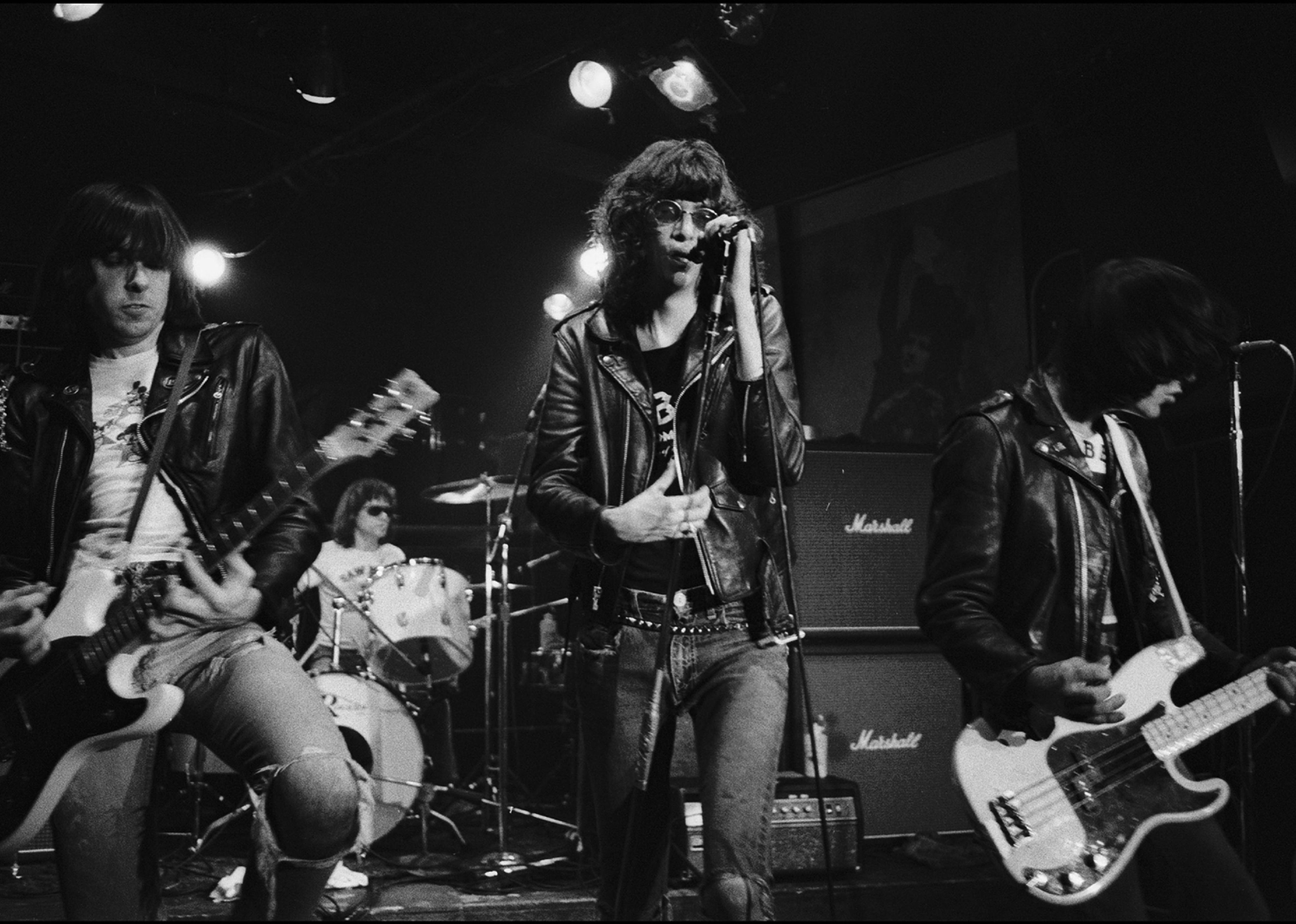 Ramones performing onstage.