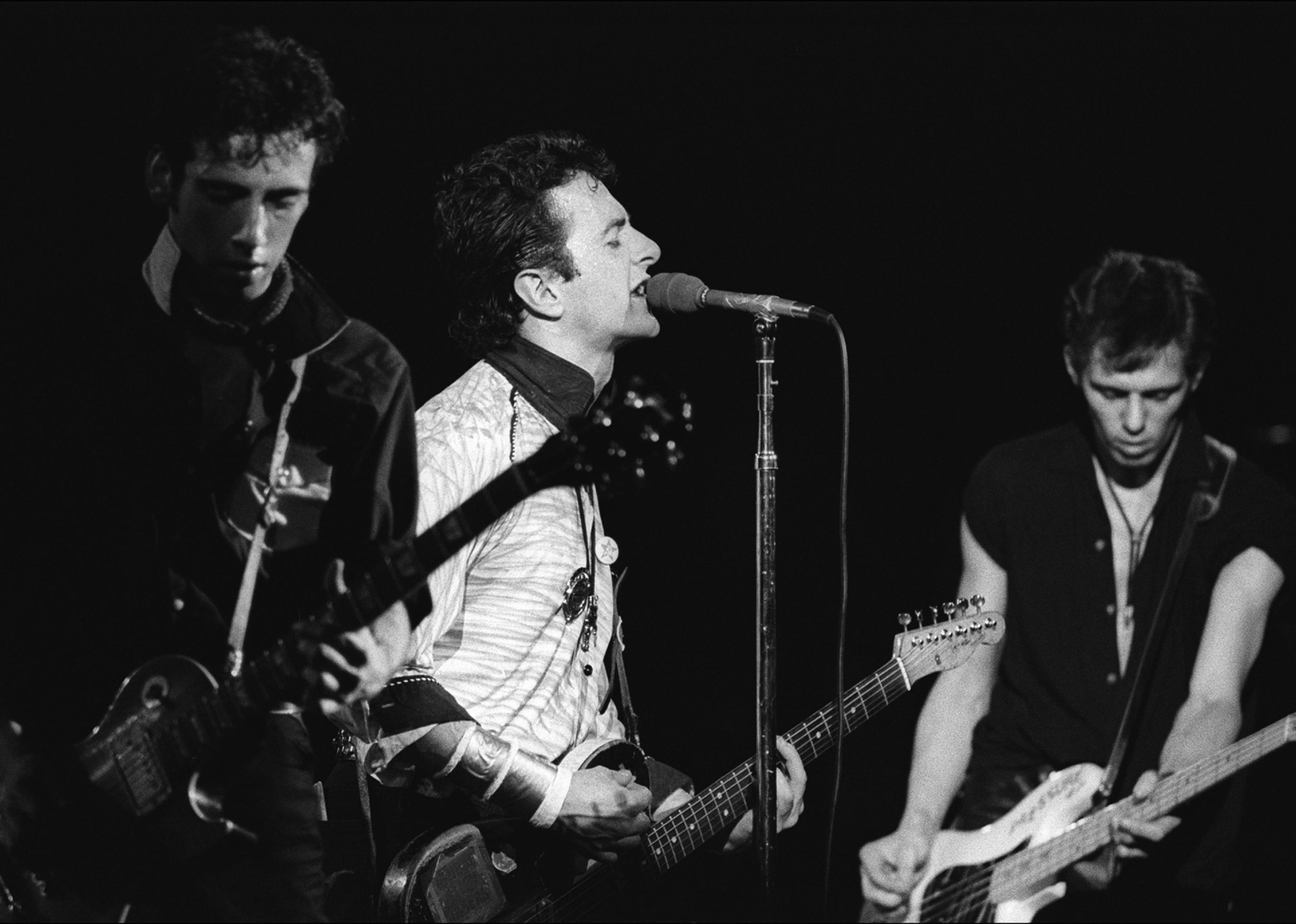 Members of the British Punk group the Clash perform onstage at the Palladium.