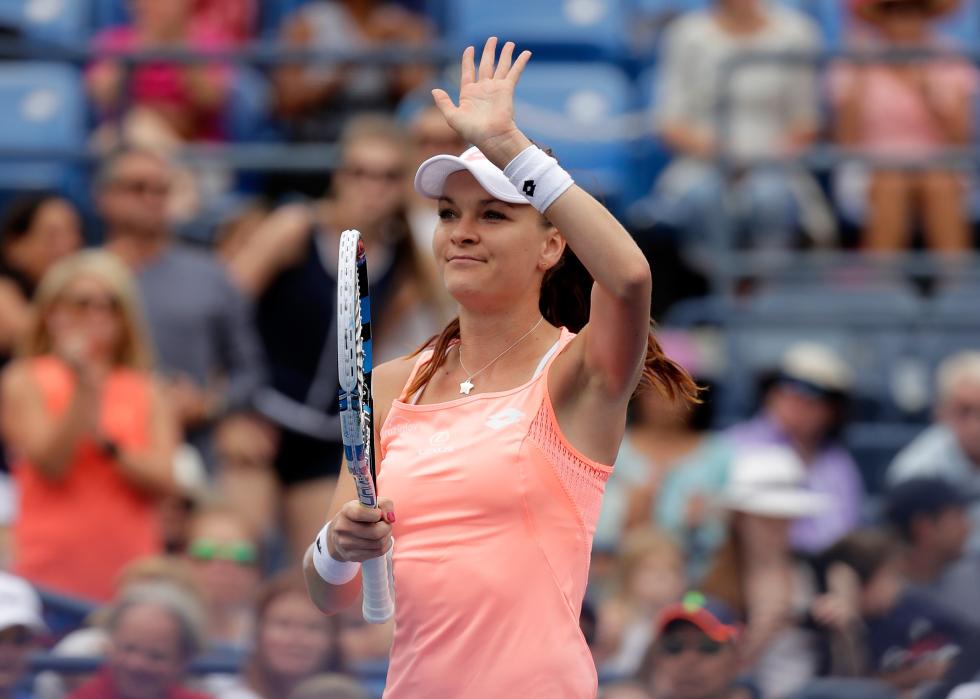 Agnieszka Radwanska of Poland acknowledges the crowd after a victory
