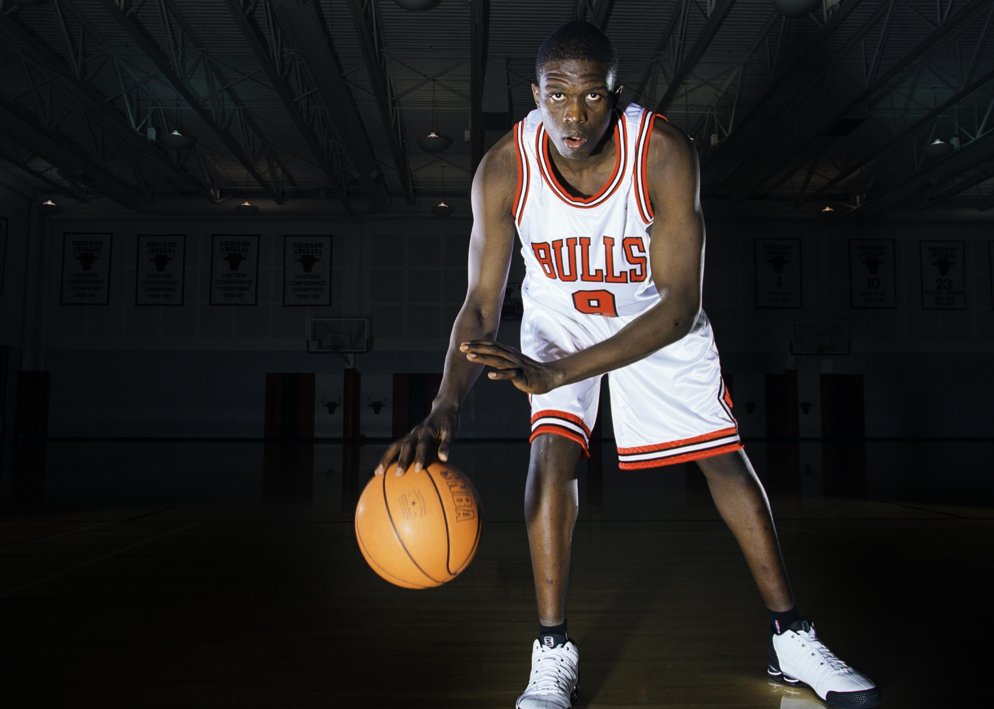 Luol Deng poses for a photo with the ball during his rookie photoshoot.