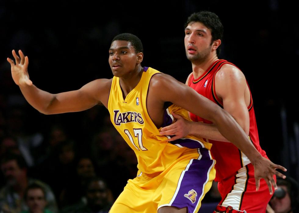 Andrew Bynum of the Los Angeles Lakers and Zaza Pachulia of the Atlanta Hawks battle for position.