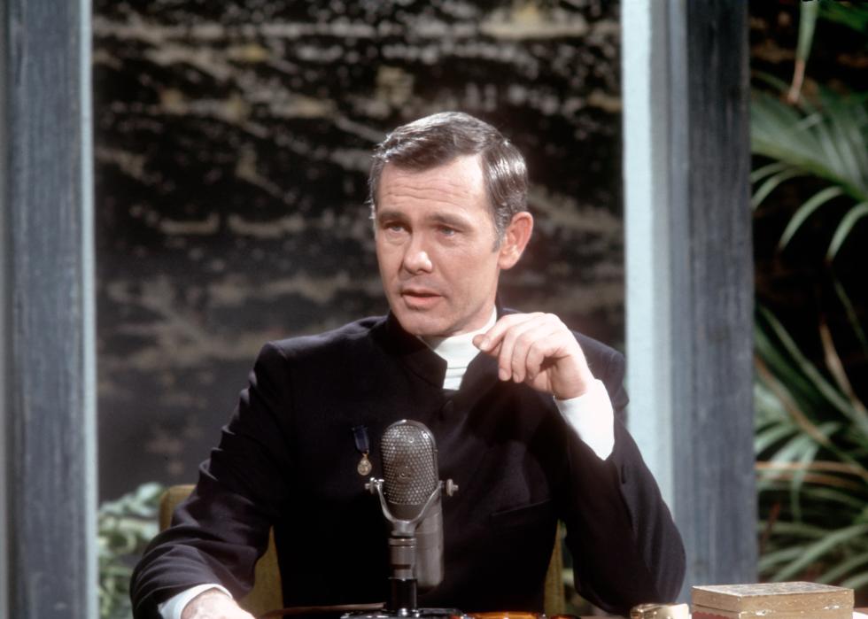 Johnny Carson at his desk on set