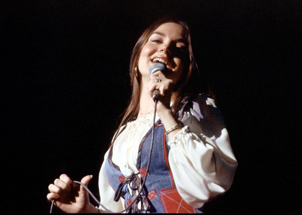 Crystal Gayle performing on stage.