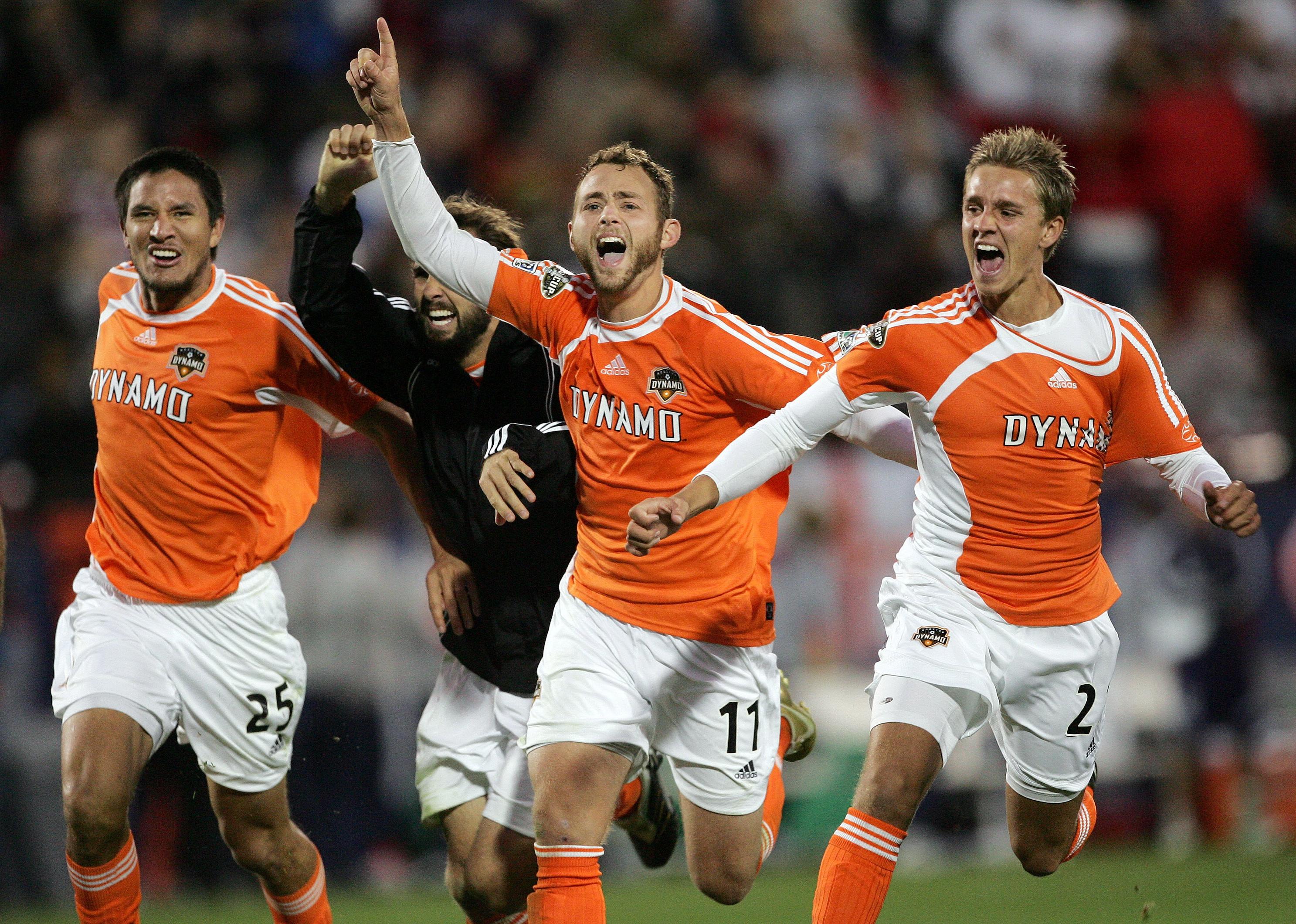 Houston Dynamo's Brian Ching, Ryan Mullan, Brad Davis, and Stuart Holden react after goalkeeper made a save on a shot.