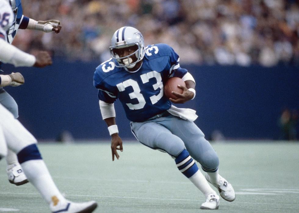 Tony Dorsett of the Dallas Cowboys carries the ball during a circa 1980's NFL game.