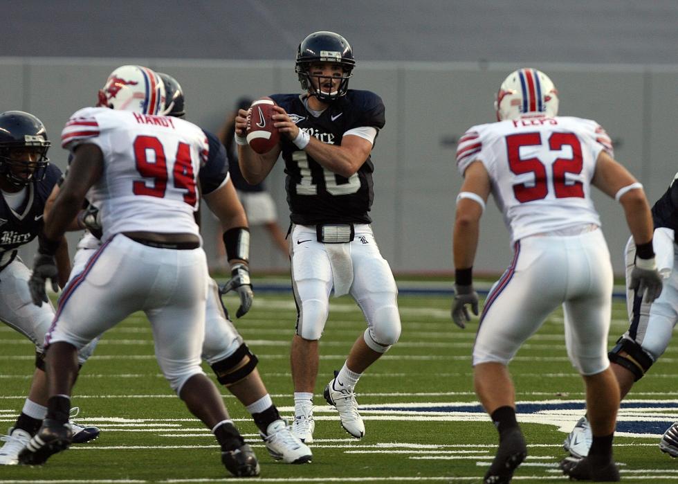 Quarterback Chase Clement of the Rice Owls looks down-field for a receiver