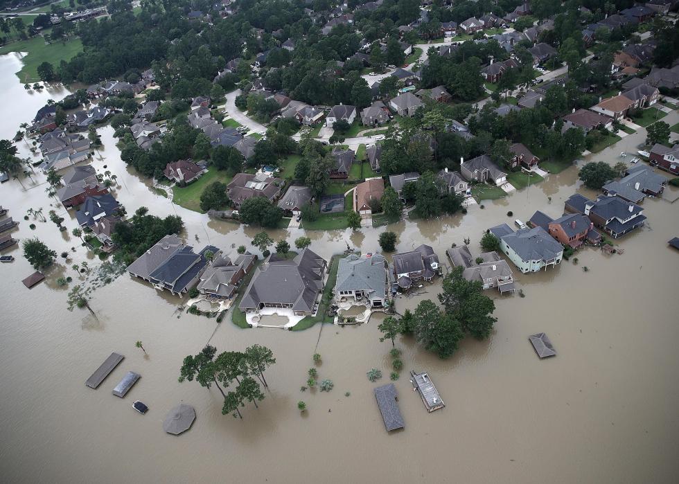 An aerial view of a flooded suburban neighborhood.