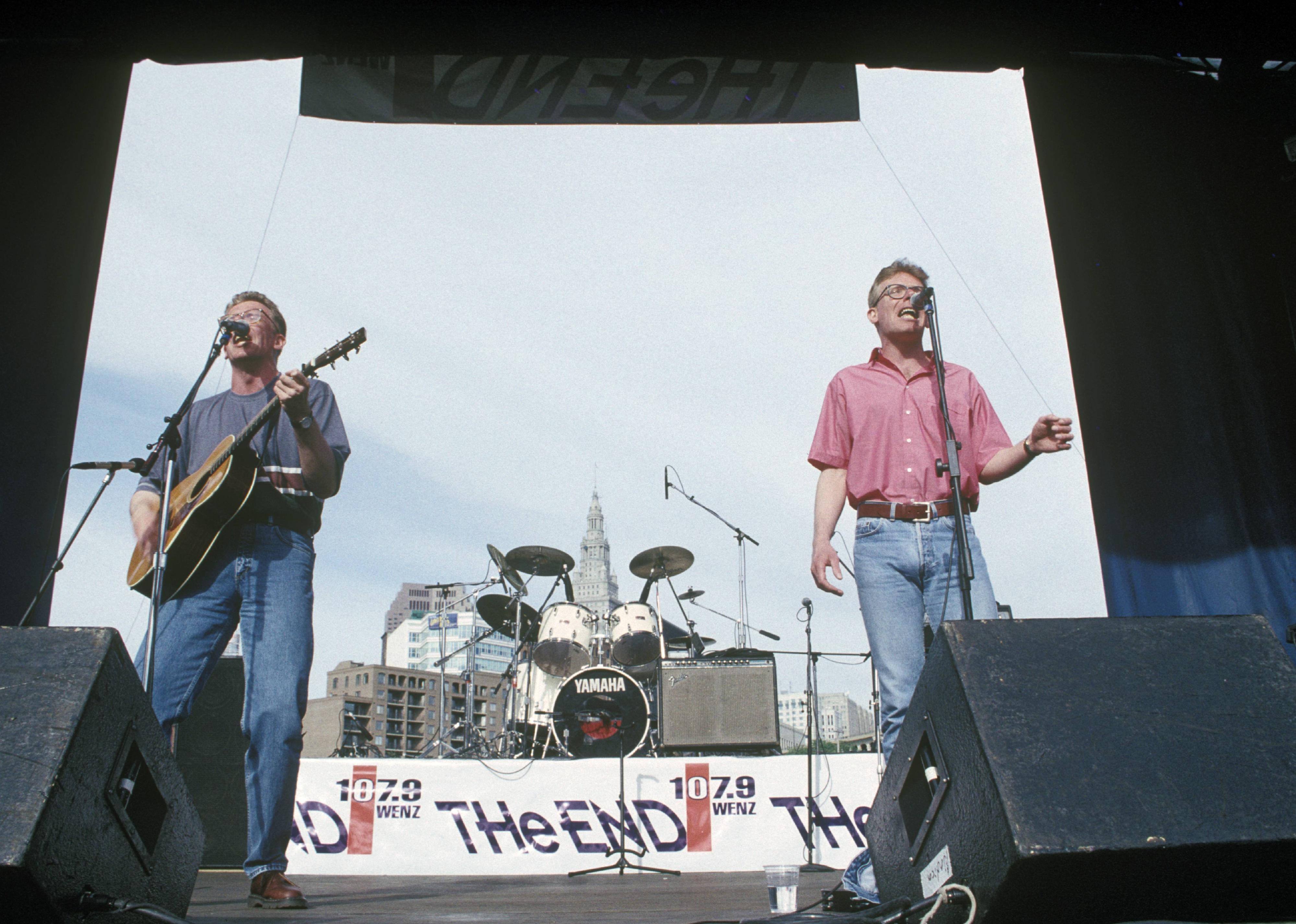 The Proclaimers performing on stage outside.