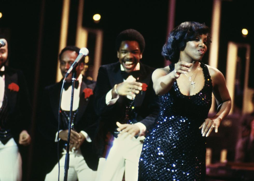 Gladys Knight performing on stage with the Pips.