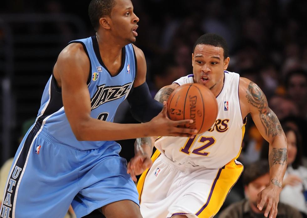 Shannon Brown of the Los Angeles Lakers looks to steal the ball from C.J. Miles of the Utah Jazz.