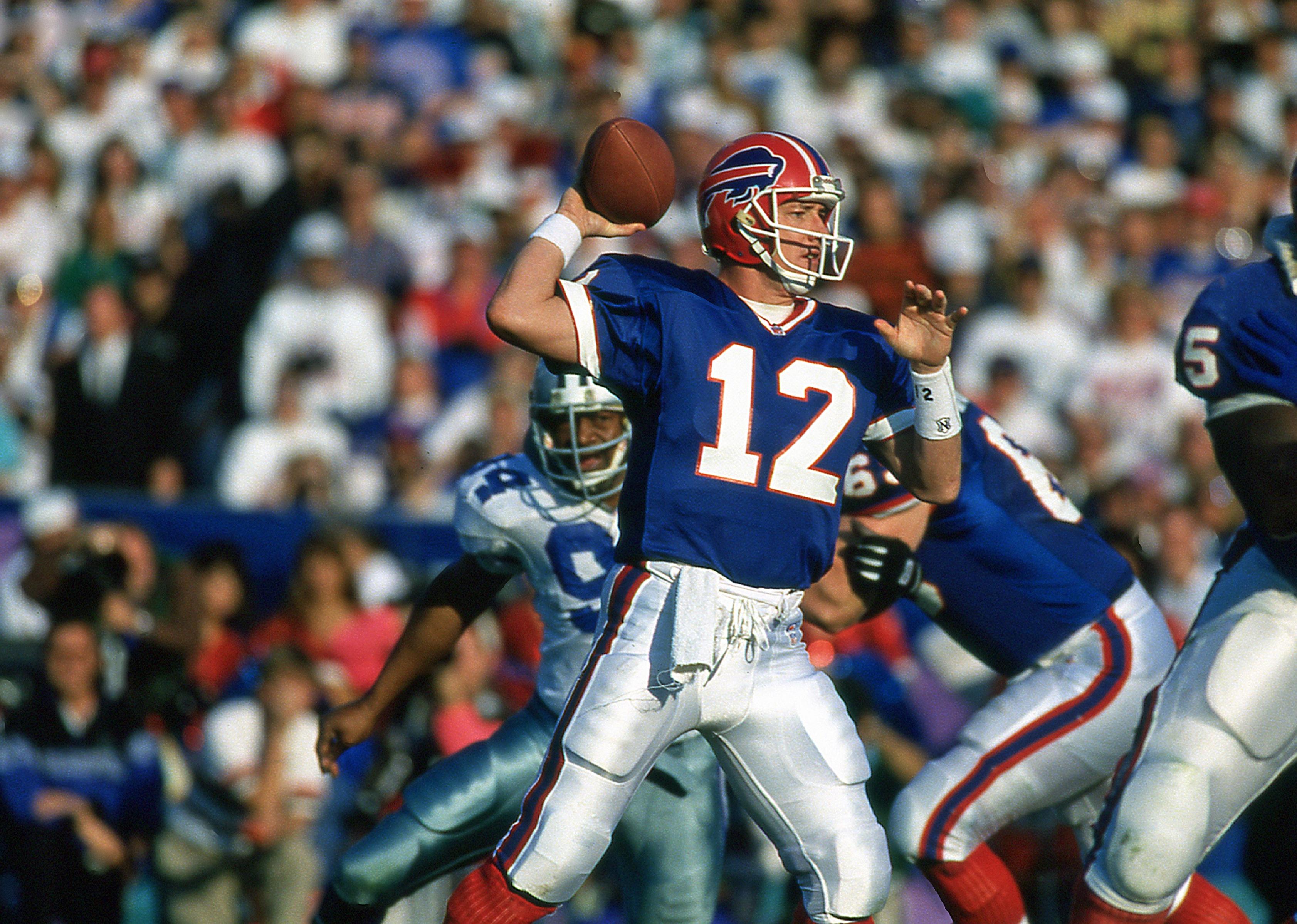 Jim Kelly of the Buffalo Bills passes against the Dallas Cowboys in Super Bowl 27.
