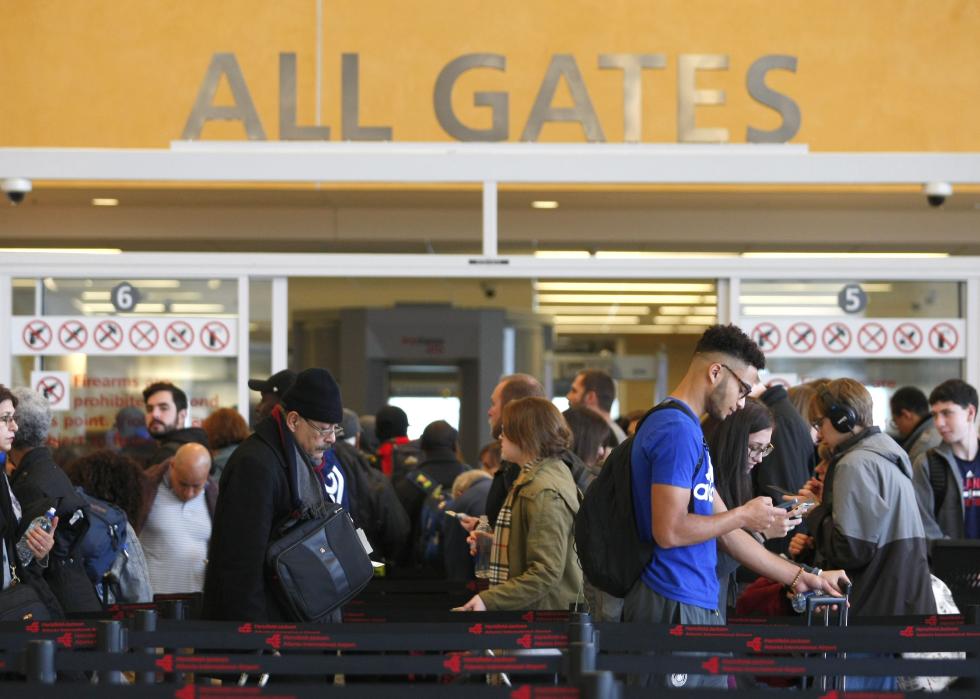 Travelers move through security lines at Hartsfield-Jackson Atlanta International Airport 