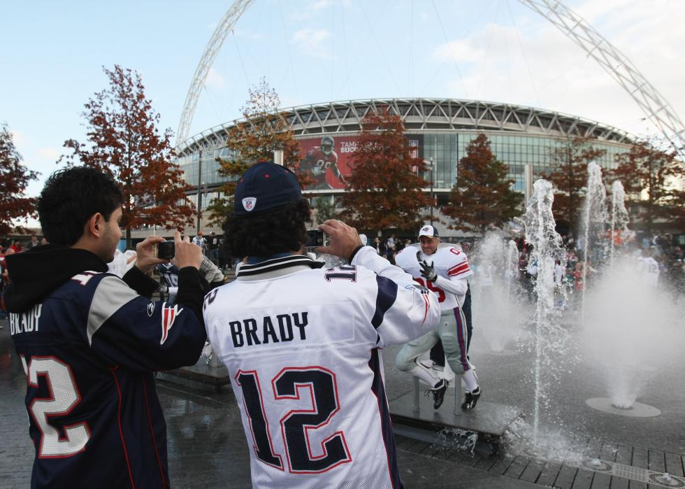 Patriots fans takes photos prior to a NFL match at Wembley Stadium.